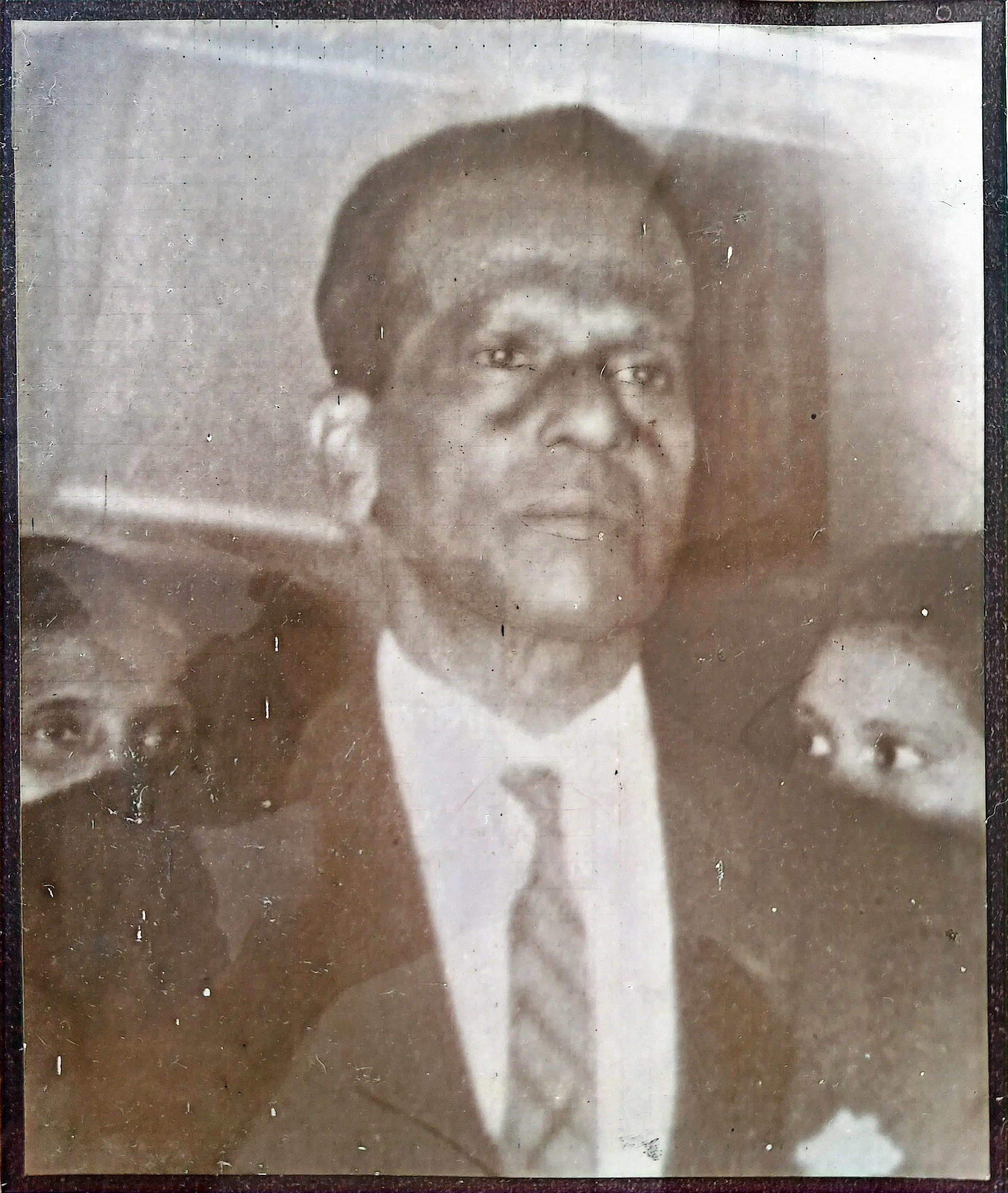 A vintage, sepia-toned portrait of Mr. Wilbert Wickramarathna, the forefather of Lankan Canela, dressed formally in a suit and tie. As a dedicated estate owner and supplier, he is pictured here as the founder who originally established the family's cinnamon trade legacy.